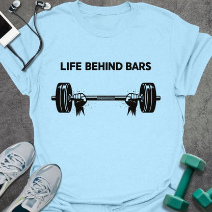 Light blue t-shirt printed with "Life Behind Bars", with a barbell
