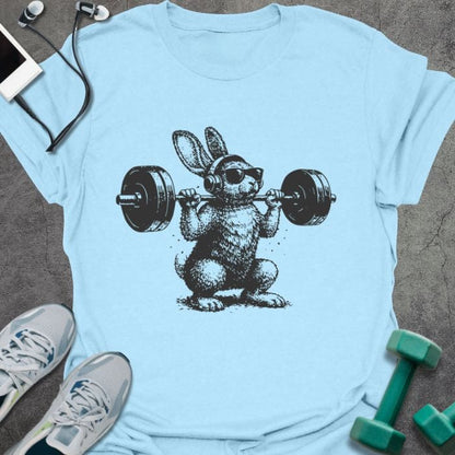 Light blue t-shirt with an illustration of a bunny doing a squat with dumbbells in black