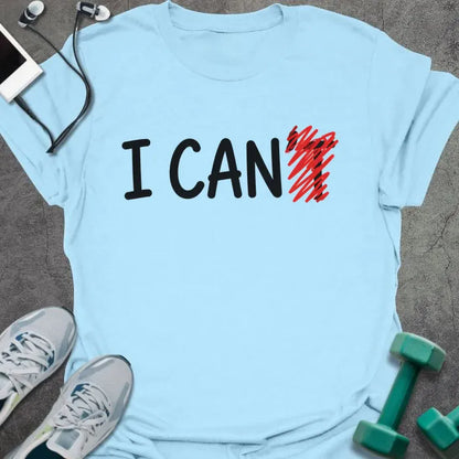 Light blue t-shirt printed with "I CAN't" in black and red, with t crossed out