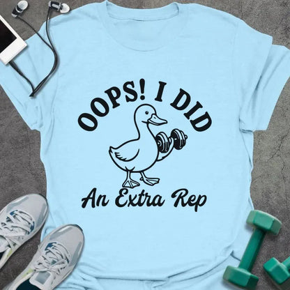 Light blue t-shirt printed with "OOPS! I DID An Extra Rep" in black, with a duck holding a dumbbell