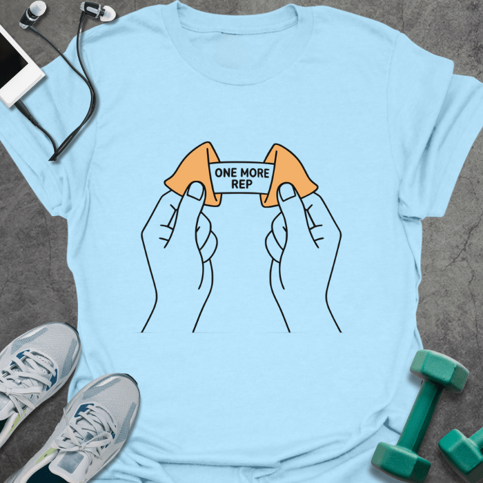 Light blue t-shirt with a fortune cookie and two lemons connected by a barbell