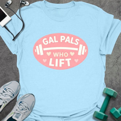 Light blue t-shirt printed with "Gal Pals Who Lift" in white, pink, with a barbell