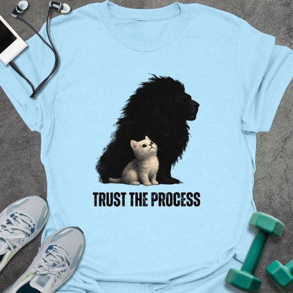 Light blue t-shirt printed with "Trust the Process", with a white kitten casting a lion shadow