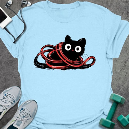 Light blue t-shirt with a black cat tangled in a red jump rope in red, black, white