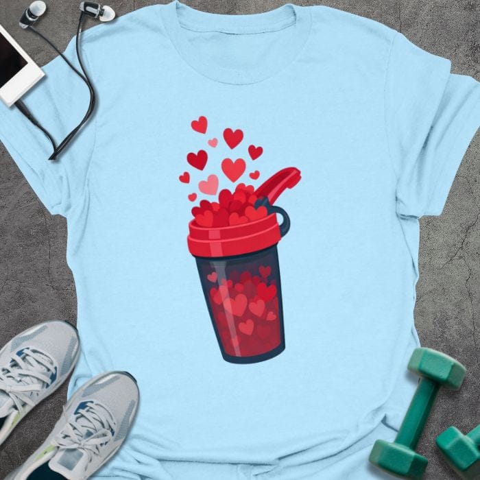 Light blue t-shirt with a protein shake container overflowing with hearts in red, blue, white, pink