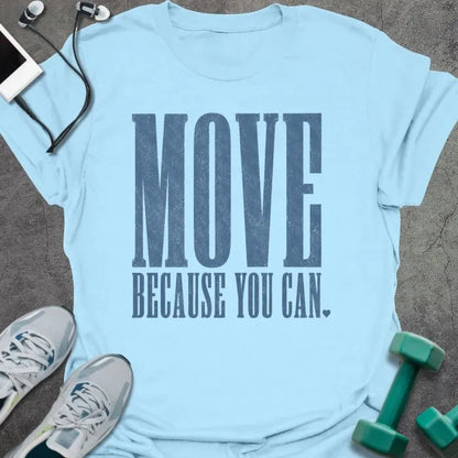 Light Blue t-shirt printed with "MOVE BECAUSE YOU CAN." in steel blue bold caps