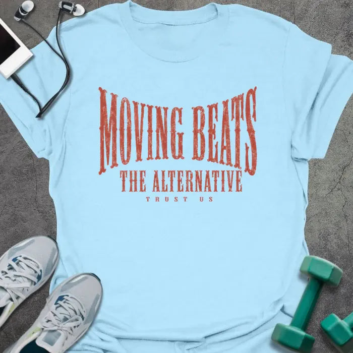 Light Blue t-shirt printed with "MOVING BEATS THE ALTERNATIVE TRUST US" in coral