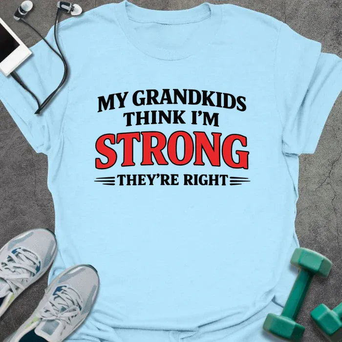 Light blue t-shirt printed with "My Grandkids Think I'm Strong They're Right" in black and red