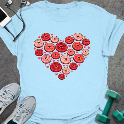 Light blue t-shirt with weight plates arranged in a heart shape in red, tan, pink, white