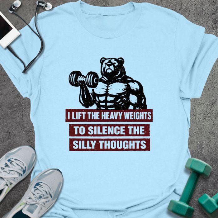 Light blue t-shirt printed with "I Lift the Heavy Weights to Silence the Silly Thoughts" in red and black, with muscular bear lifting dumbbell
