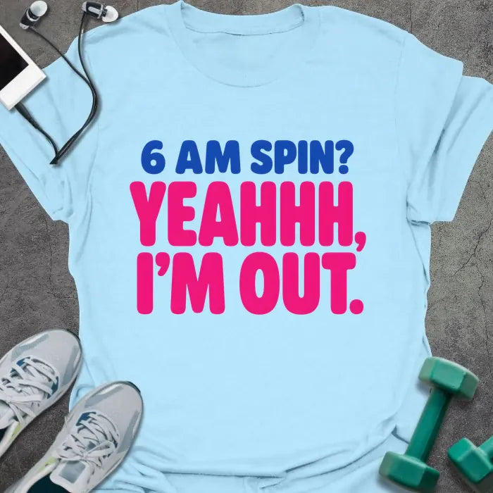 Light blue T-shirt printed with "6 AM SPIN? YEAHHH, I'M OUT." in blue and pink