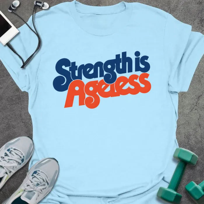 Light Blue t-shirt printed with "Strength is Ageless" in blue and red lettering