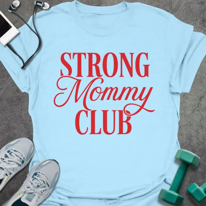 Light blue t-shirt printed with "STRONG Mommy CLUB" in red and white, with a decorative script flourish on 'Mommy'
