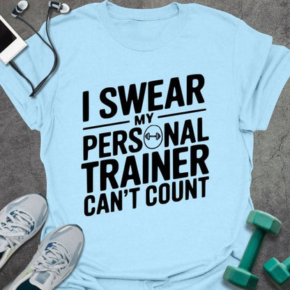 Light blue t-shirt printed with "I Swear my Personal Trainer Can't Count"