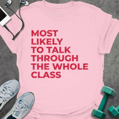 Light pink t-shirt printed with "MOST LIKELY TO TALK THROUGH THE WHOLE CLASS" in red