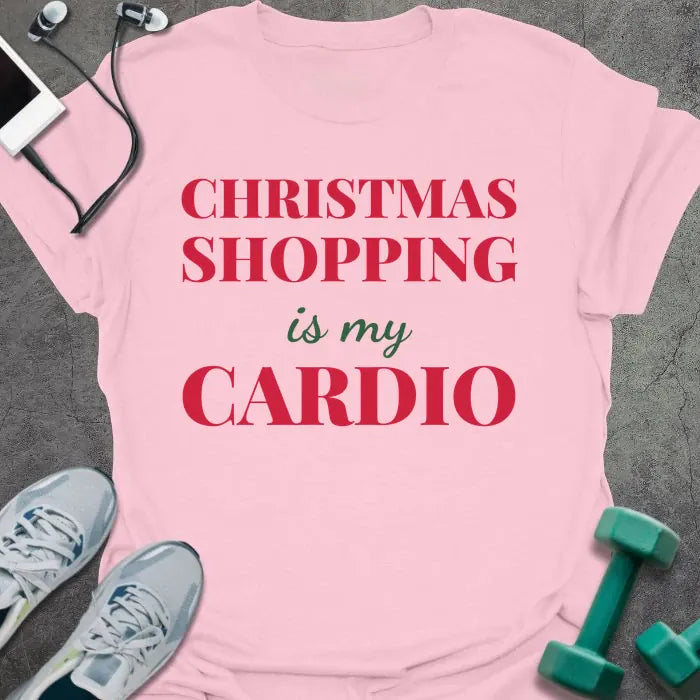Light pink t-shirt printed with "CHRISTMAS SHOPPING is my CARDIO" in red and green