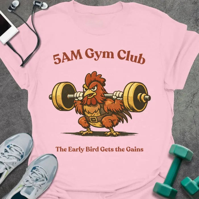 Light pink t-shirt printed with "5AM Gym Club The Early Bird Gets the Gains" in red and brown, with rooster lifting barbell graphic