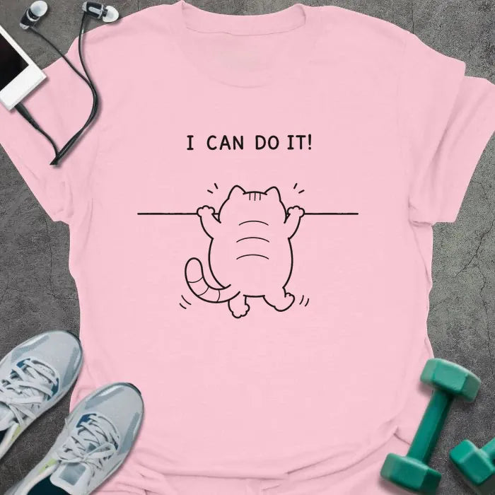 Light Pink t-shirt printed with "I CAN DO IT!" in black, with cat attempting pullup