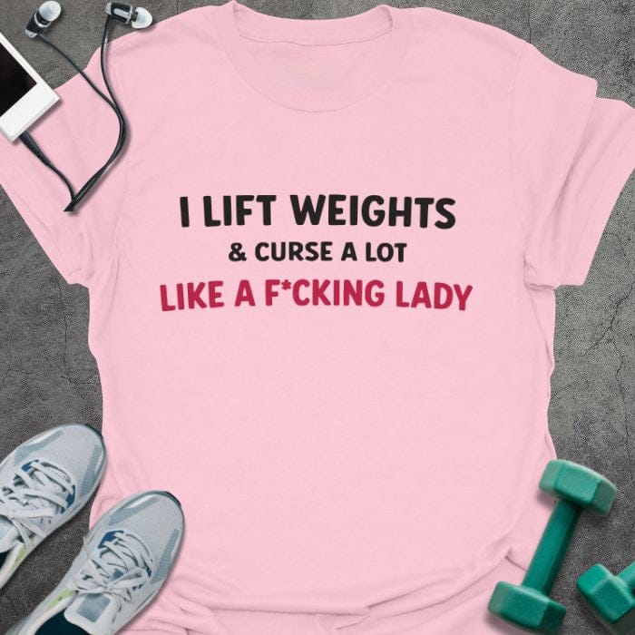 Light pink t-shirt printed with "I Lift Weights & Curse a Lot Like a F Cking Lady" in red