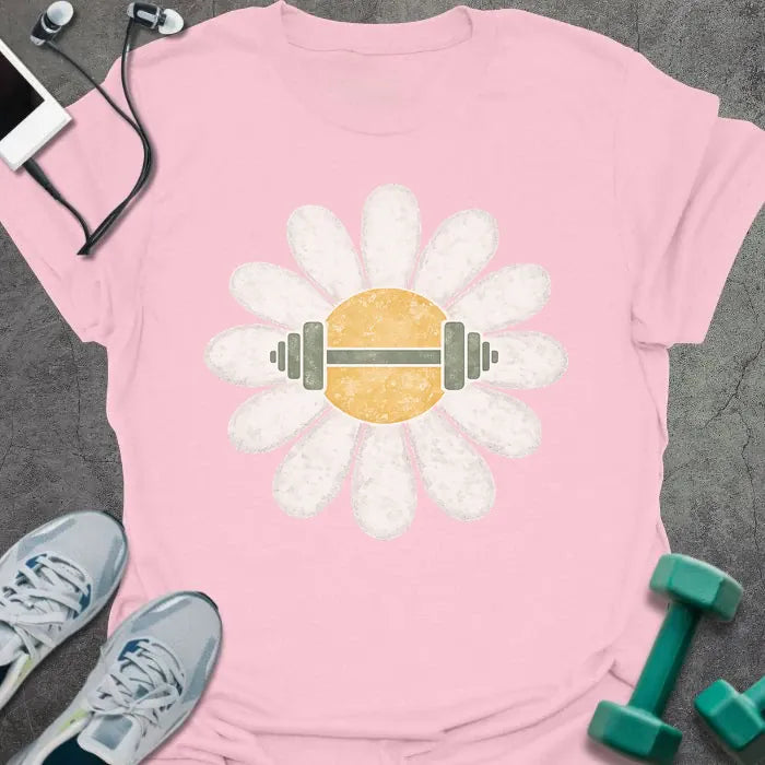 Light pink t-shirt with a white daisy featuring a barbell at its center with green and white elements in white, yellow, and green