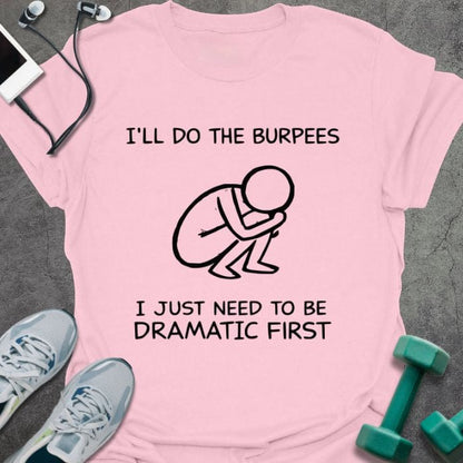 Light pink t-shirt printed with "I'll Do the Burpees I Just Need to Be Dramatic First", with stick figure illustration