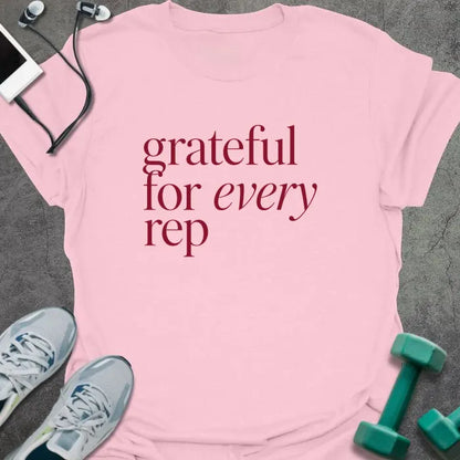 Light Pink t-shirt printed with "grateful for every rep" in burgundy