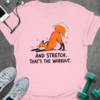 Light Pink t-shirt printed with "AND STRETCH. THAT'S THE WORKOUT." in black lettering, with a red fox in a stretching pose