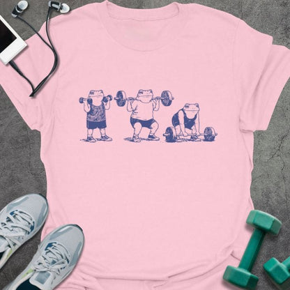 Light pink t-shirt with an illustration of three people lifting dumbbells in blue