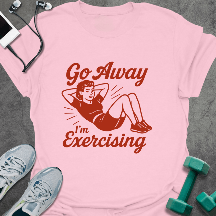 Light pink t-shirt printed with "Go Away I'm Exercising" in red and brown, with an illustration of a woman doing a sit-up