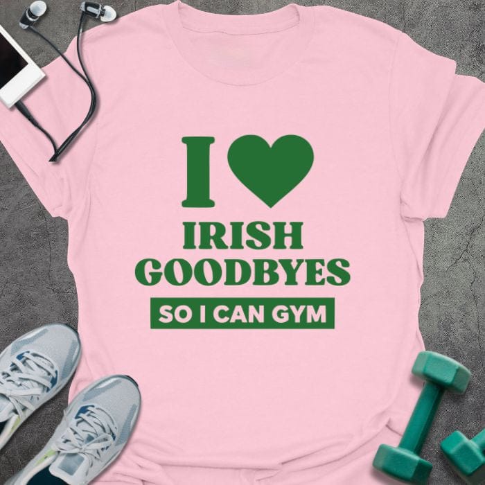 Light pink t-shirt printed with "I Heart Irish Goodbyes so I Can Gym" in green, with clover
