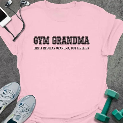Light pink t-shirt printed with "GYM GRANDMA, LIKE A REGULAR GRANDMA, BUT LIVELIER" in charcoal varsity letters