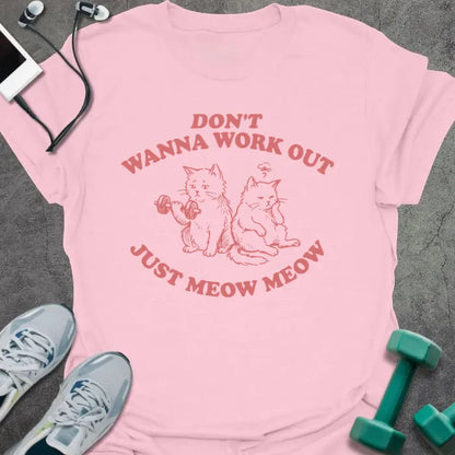 Light pink t-shirt printed with "Don't Wanna Work Out Just Meow Meow" in pink, with an illustration of two cats