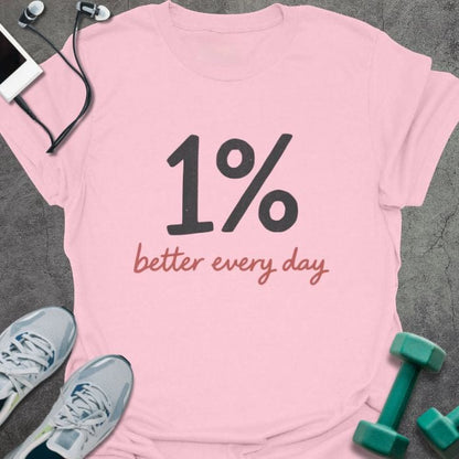 Light pink t-shirt printed with "1% better every day" in black, rust red