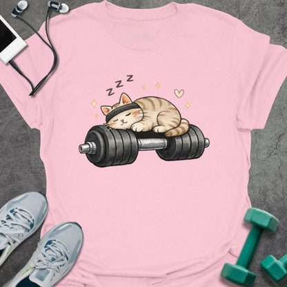 Light pink t-shirt with a sleeping cat on a dumbbell in tan, white
