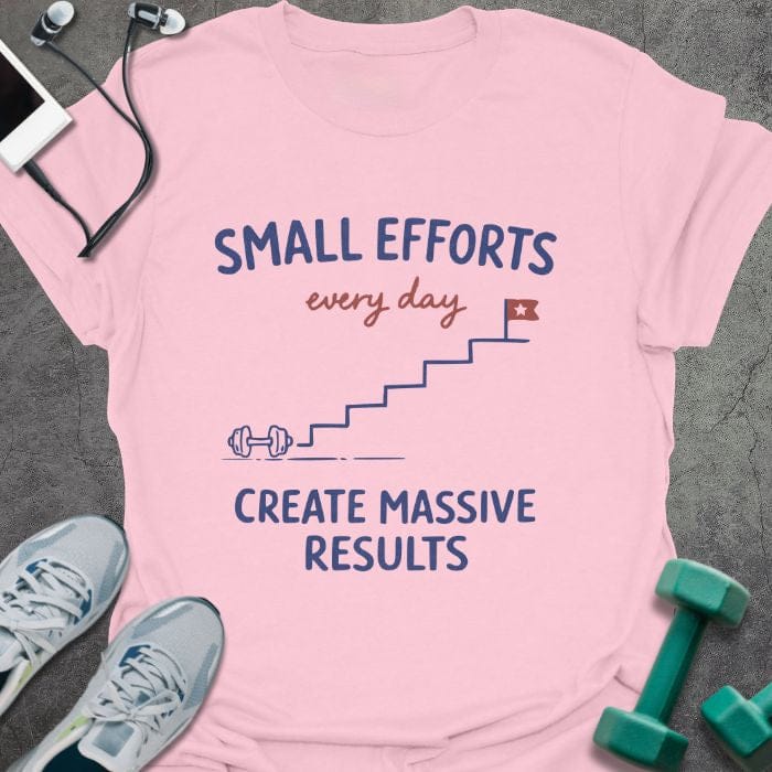 Light pink t-shirt printed with "SMALL EFFORTS every day CREATE MASSIVE RESULTS" in red and blue, with stairs and flag illustration