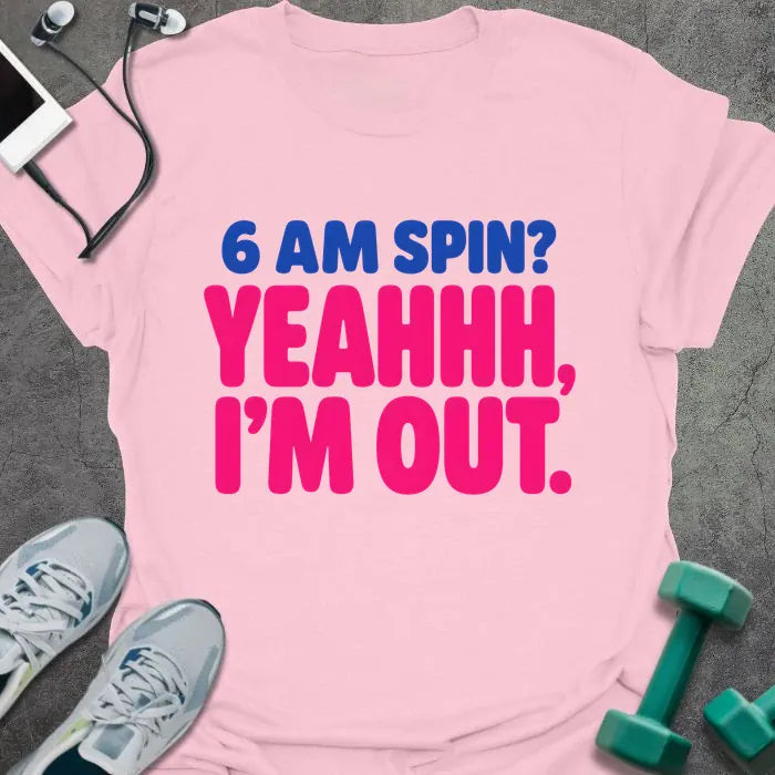 Light pink T-shirt printed with "6 AM SPIN? YEAHHH, I'M OUT." in blue and pink