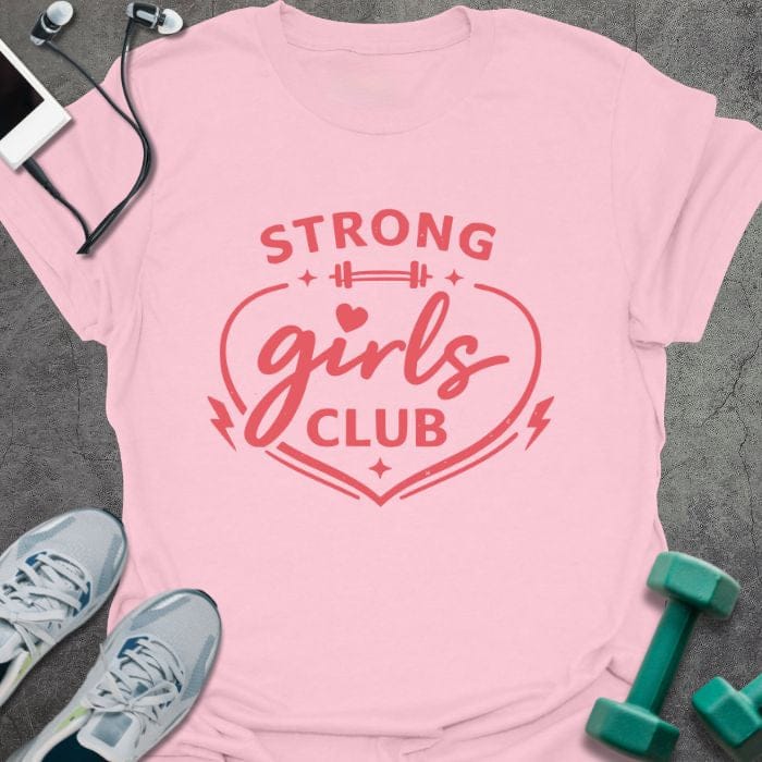 Light pink t-shirt printed with "STRONG girls CLUB" in red, with a heart, barbell, and lightning bolt icons