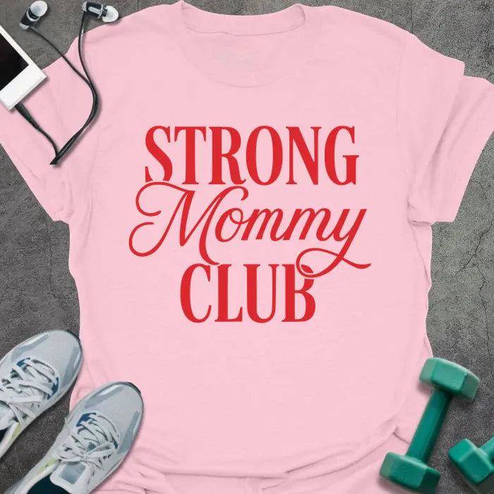 Light pink t-shirt printed with "STRONG Mommy CLUB" in red and white, with a decorative script flourish on 'Mommy'