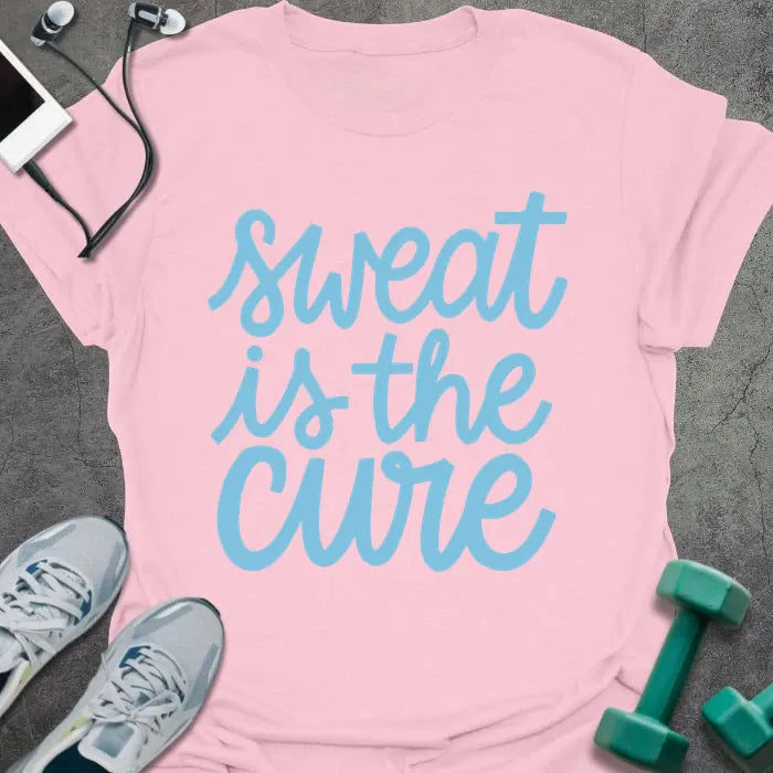 Light pink t-shirt printed with "sweat is the cure" in blue