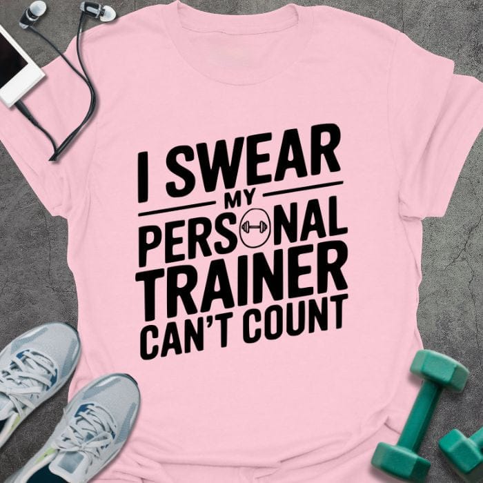 Light pink t-shirt printed with "I Swear my Personal Trainer Can't Count"
