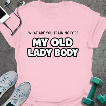 Light pink t-shirt printed with "What Are You Training for? my Old Lady Body", with outlined text styling