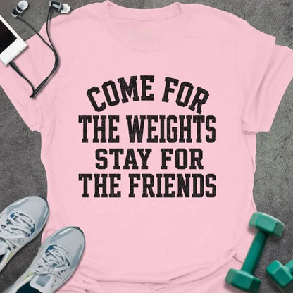 Light Pink t-shirt printed with "COME FOR THE WEIGHTS STAY FOR THE FRIENDS" in black bold caps