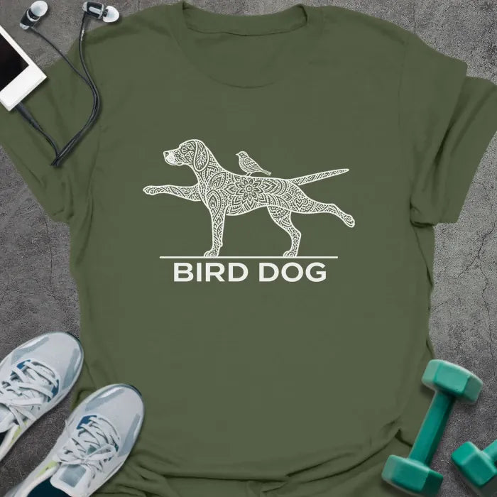 Military green t-shirt printed with "BIRD DOG" in white, with a patterned dog in the bird dog exercise pose and a small bird on its back