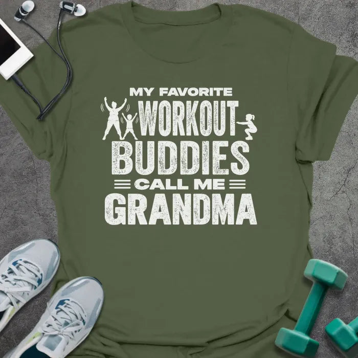 Military green t-shirt printed with "MY FAVORITE WORKOUT BUDDIES CALL ME GRANDMA" in white, with a grandmother and two kids doing jumping jacks and squats