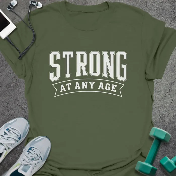 Military green t-shirt printed with "Strong at Any Age" in white, with a decorative banner