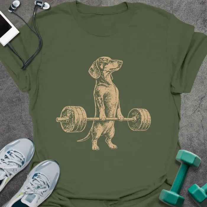 Military green t-shirt with an illustration of a Dachshund holding a barbell in white