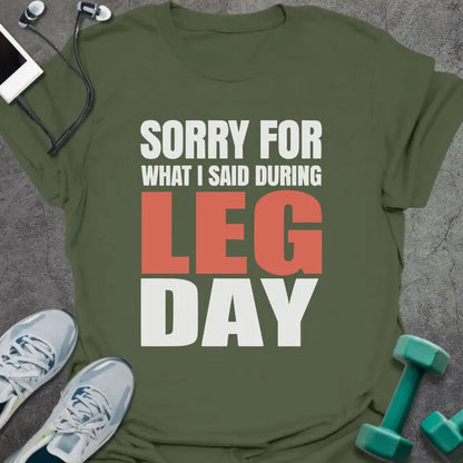 Military green t-shirt printed with "Sorry for What I Said During Leg Day" in white and red
