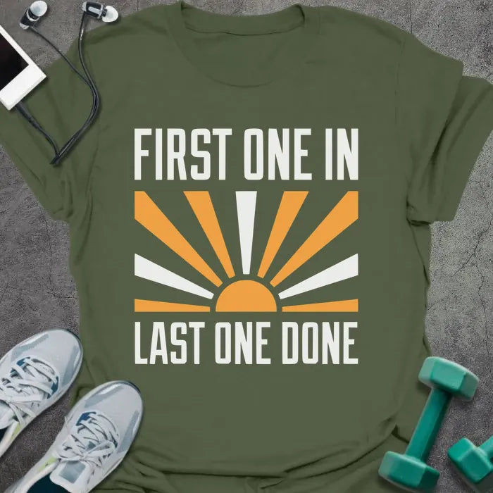 Military green t-shirt printed with "First One in Last One Done" in orange and white, with sun graphic