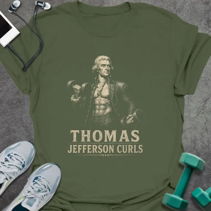 Military green t-shirt printed with "Thomas Jefferson Curls", with an illustration of Thomas Jefferson with an exposed muscular torso doing dumbbell curls