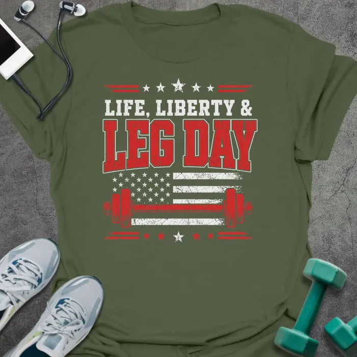 Military green t-shirt printed with "Life. Liberty & Legday" in white and red, with stars, a stars-and-stripes flag, and a barbell